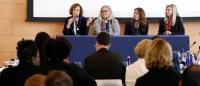 panelists speak in front of crowd